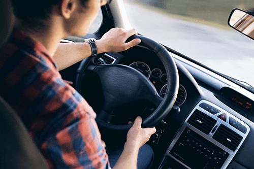 Man driving a car.